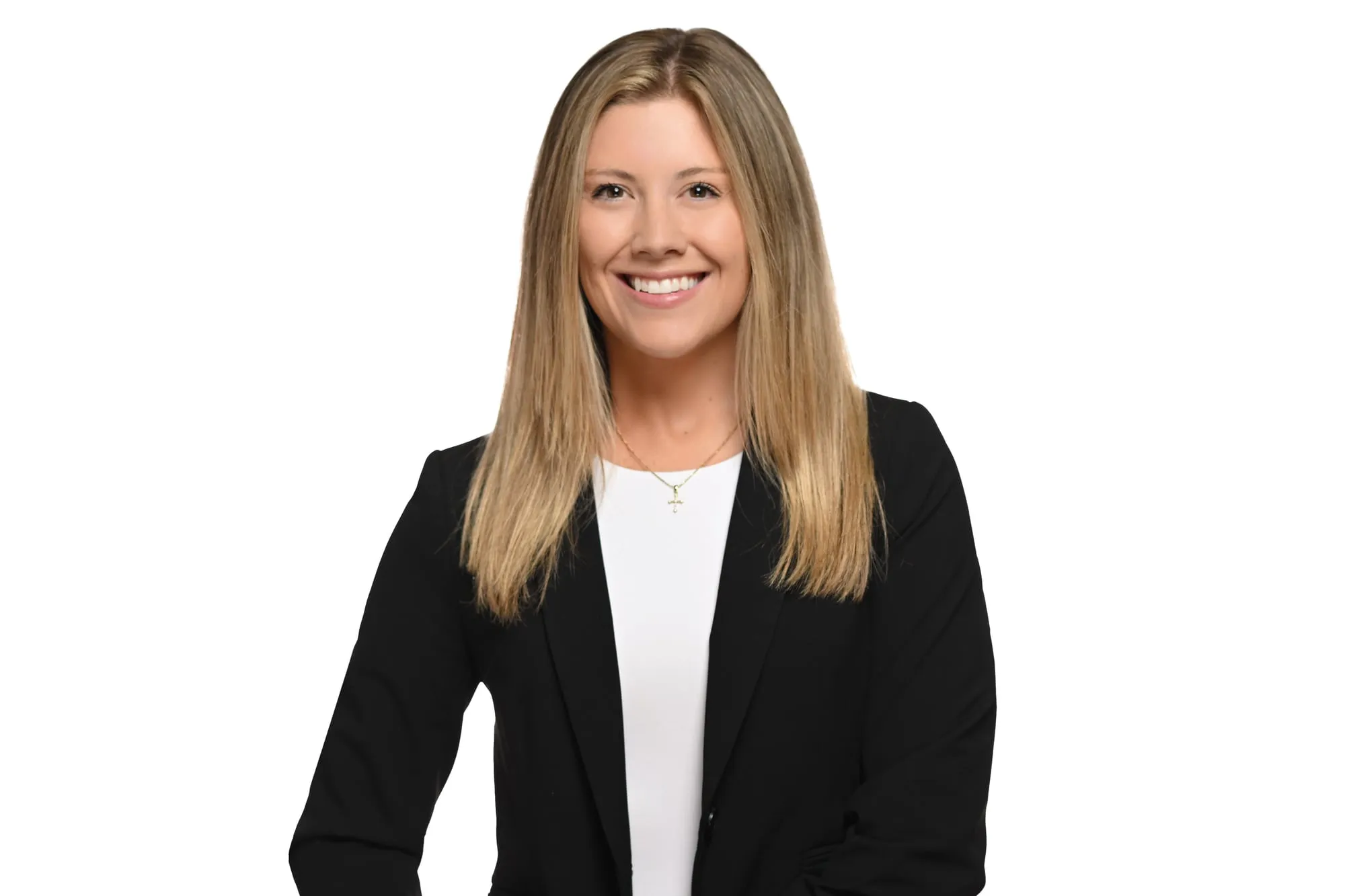 Studio headshot on a white background: black blazer over a white top