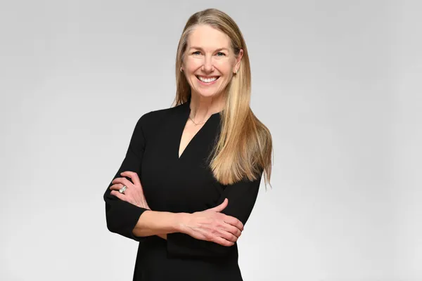 Corporate headshot for Tract in Denver on a light grey background